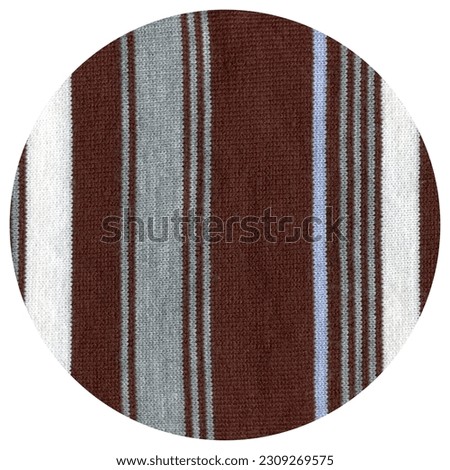 Pattern fabric made of wool. Handmade knitted fabric white brown and blue wool background texture