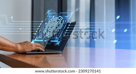 Unrecognizable businessman using laptop at wooden table with double exposure of fingerprint interface in office. Concept of biometric authentication and cybersecurity