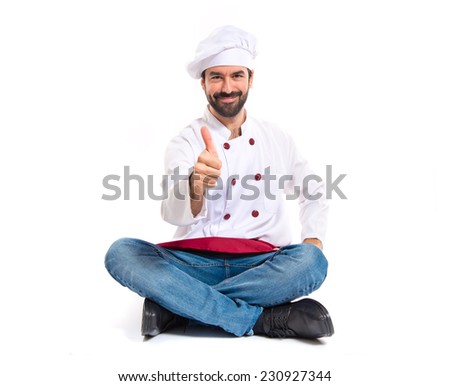 Chef with thumb up over white background