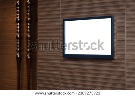 Rectangular display on the wall of the hotel in the corridor