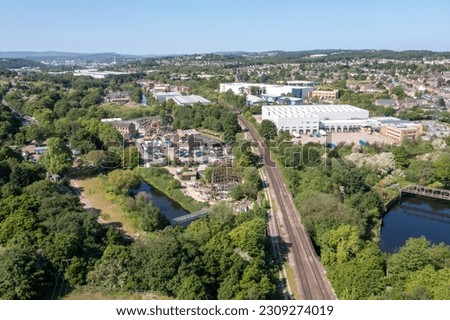 Aerial drone photo of the village of Kirkheaton, Huddersfield in the Kirklees district in the county of West Yorkshire England showing the village and River Calder from above in the summer time.