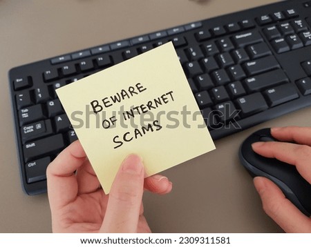 Scam concept. Beware of Internet scam Royalty-Free Stock Photo #2309311581