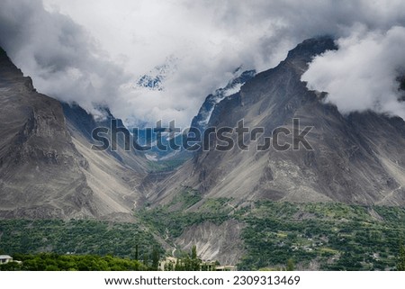 Dark Mountains covered with white clouds. Pakistani mountains. Sakardu mountains. 