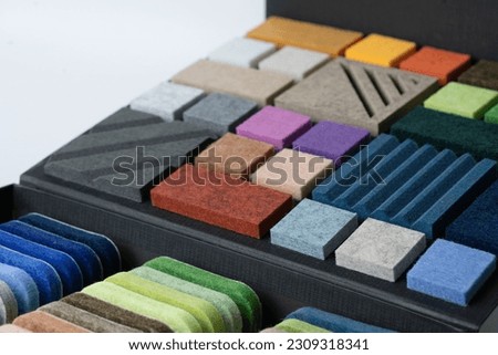 Samples of acoustic polyester material in different colors Royalty-Free Stock Photo #2309318341