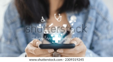 Technology network healthcare concept. Female using smartphone with virtual medical healthcare. Network connection online communication to hospital. Royalty-Free Stock Photo #2309319245