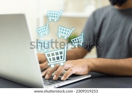 Man using laptop shopping online, shopping cart icon on screen. purchase payment on internet. online supermarket gadget. customer sale and payment.