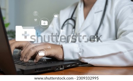 Doctors use  computer to research medical information. medical concept.