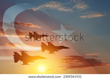Aircraft silhouettes on background of sunset with a transparent Turkey flag. Air Force aerobatic demonstration. Air Force Day. Turkish Air Force Foundation Day. Royalty-Free Stock Photo #2309341931