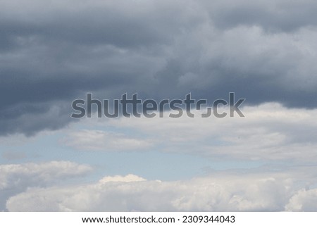 A grey sky with clouds