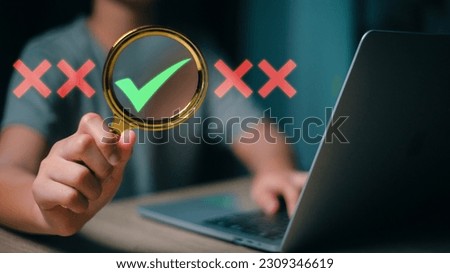 Focusing on the right choice concept. Hand holds magnifying glass focusing on the checkmark or tick right symbol next to wrong cross icons.