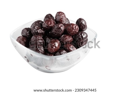 Dried olives isolated on white background Royalty-Free Stock Photo #2309347445