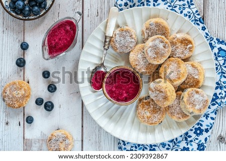 Traditional fennel Welsh cakes with blueberry coulis Royalty-Free Stock Photo #2309392867