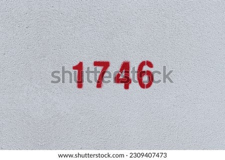 Red Number 1746 on the white wall. Spray paint.
 Royalty-Free Stock Photo #2309407473