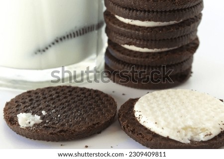 "Chocolate Cookies and Milk on White Background: Product Photography"