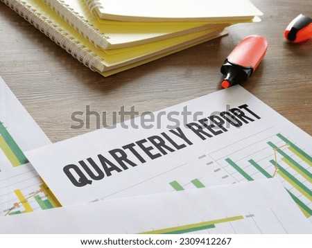 Quarterly report is shown using a text Royalty-Free Stock Photo #2309412267