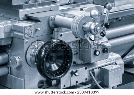 Lathe control knobs close up blue tone. Metal machine tools industry. The metalworking process by turning machine. industry metal processing concept background