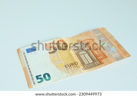 A fifty euro note. A single banknote on the white background. Close-up and minimalistic photo.