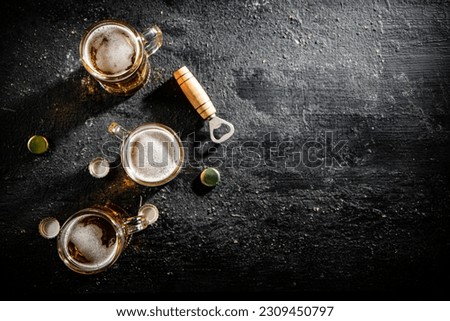 Glasses with beer . On rustic background.