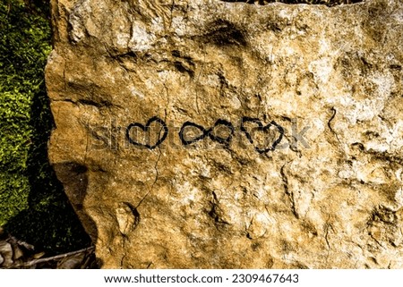 written on the rock with heart and infinity sign that identifies love forever in Vallonara Vicenza Veneto Italy