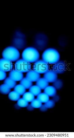 Abstract blue light against a black background