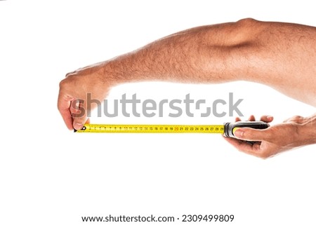 Yellow measuring tape in male hands isolated on white background,. High quality photo