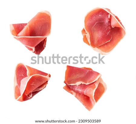 Parma ham prosciutto isolated on white background top view. Royalty-Free Stock Photo #2309503589