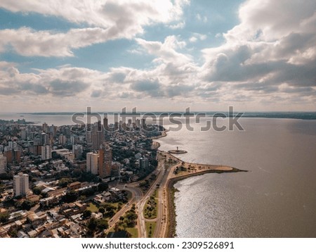 Aerial view of the city Posadas in the interior of Argentina. Buildings, vegetation and urban life.