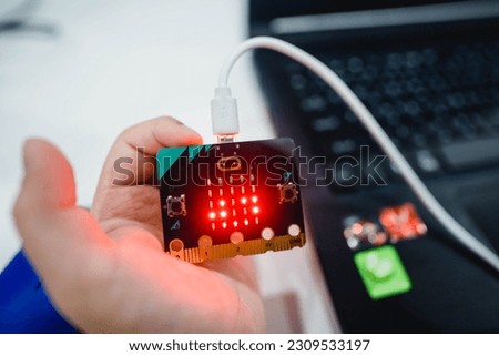 Primary school students play with Microbit and the block code in the background in the computer lab. Technology school Micro bit with coding.stem education.Creative.Robotic Ai. Coding. Learning. Royalty-Free Stock Photo #2309533197