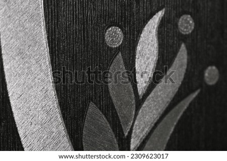 black and white flower painting on the wall