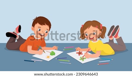 Happy little kids drawing painting together lying on the floor Royalty-Free Stock Photo #2309646643