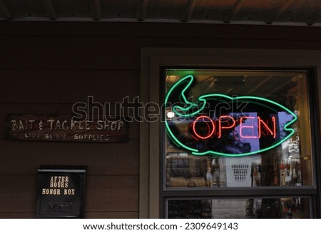 Neon Open Sign in Window of Rural Bait and Tackle Shop 