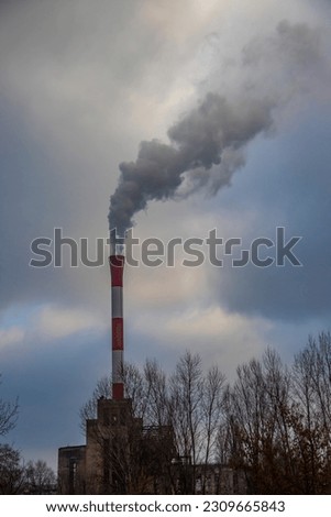 City pollution mixed with morning fog, coming from industrial chimney, Belgrade cityscape, save the environment and emission of carbon footprint 