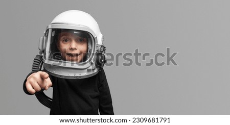 Small child wants to fly an in space wearing an astronaut helmet, on Lush Lavabackground