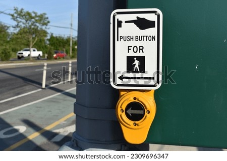 Push Button to Cross Street, Crosswalk Sign in New York. High quality photo