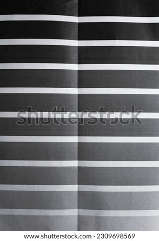macro shot of folded copy paper test print to check the dark printer cartridge.