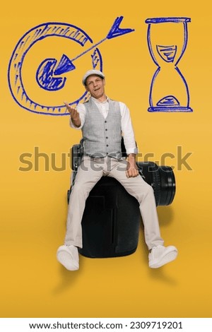 Happy male professional photographer Inspired for career goals achievement, on a yellow background