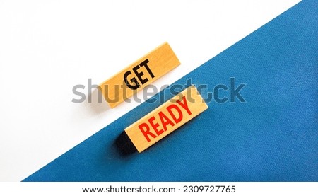 Get ready symbol. Concept words Get ready on wooden blocks on a beautiful white and blue background. Business, support, motivation and get ready concept. Copy space.