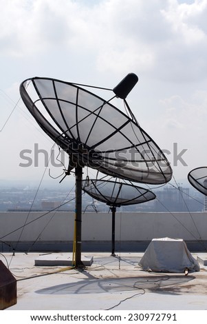 satellite dishes on the roof of skyscrapers, sea, sky, clouds