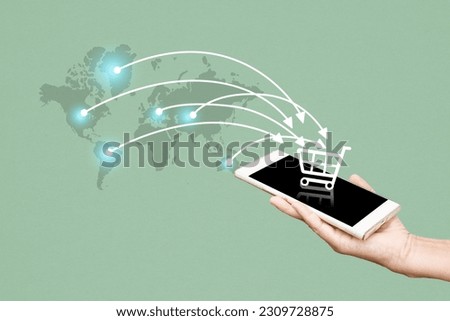 Online shopping concept , hand holding mobile phone with shopping cart icon and world map on grunge green background