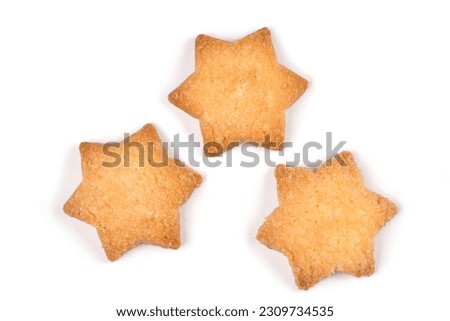 Three cookies in the shape of a star on a white background. Shortbread biscuits isolated on a white background.