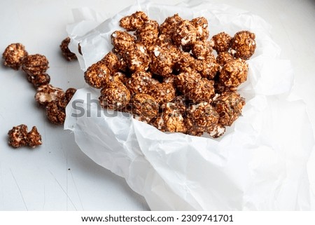 chocolate popcorn. served on a bowl. isolated background in white