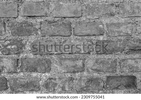 monochrome texture of old brick wall or pavement closeup, black and white vintage gray background macro, wallpaper for design