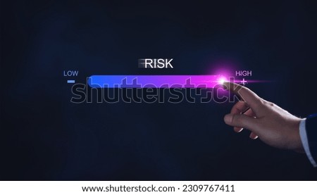 Risk management and chance to increase exposure for financial investment, projects, engineering, business. get maximum profit. Concept with manager's hand slide to high level. Fully open to risk. Royalty-Free Stock Photo #2309767411