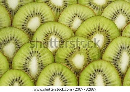 Many kiwi slices are placed in a crisper glass. Sliced ​​kiwi fruit without skin. stock photo