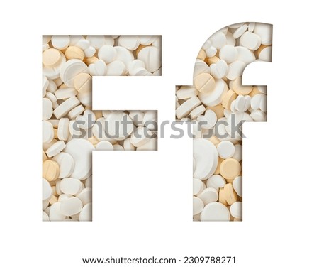 Letter F of English alphabet made of tablets of medicines, supplements or vitamins. Typeface from pills for drugstore