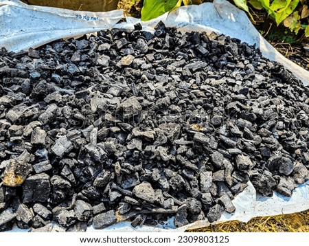 charcoal that is being burned in the afternoon
