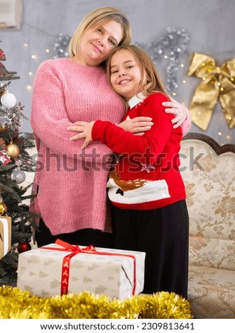 Mom and daughter together next to the