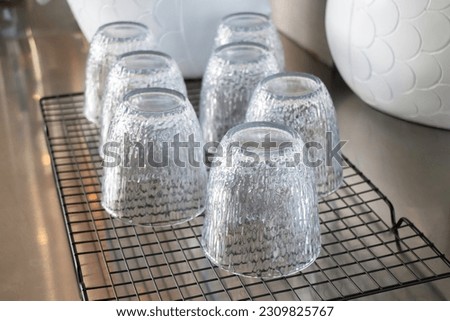 Many clean washed glasses in a row, stock photo