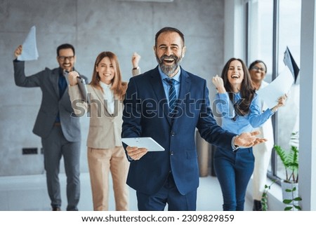Successful businesspeople having a meeting in an office. Business concept. Business meeting office conference team teamwork. Business People Celebrating with arm raised up