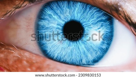 VFX Visualization: Macro Shot Of Human Eye Pupil Reacting To Light With Edited Blue Lines Filing Up The Iris. Concept of Positive Energy Running Through Beautiful Blue Eyes of a Person.